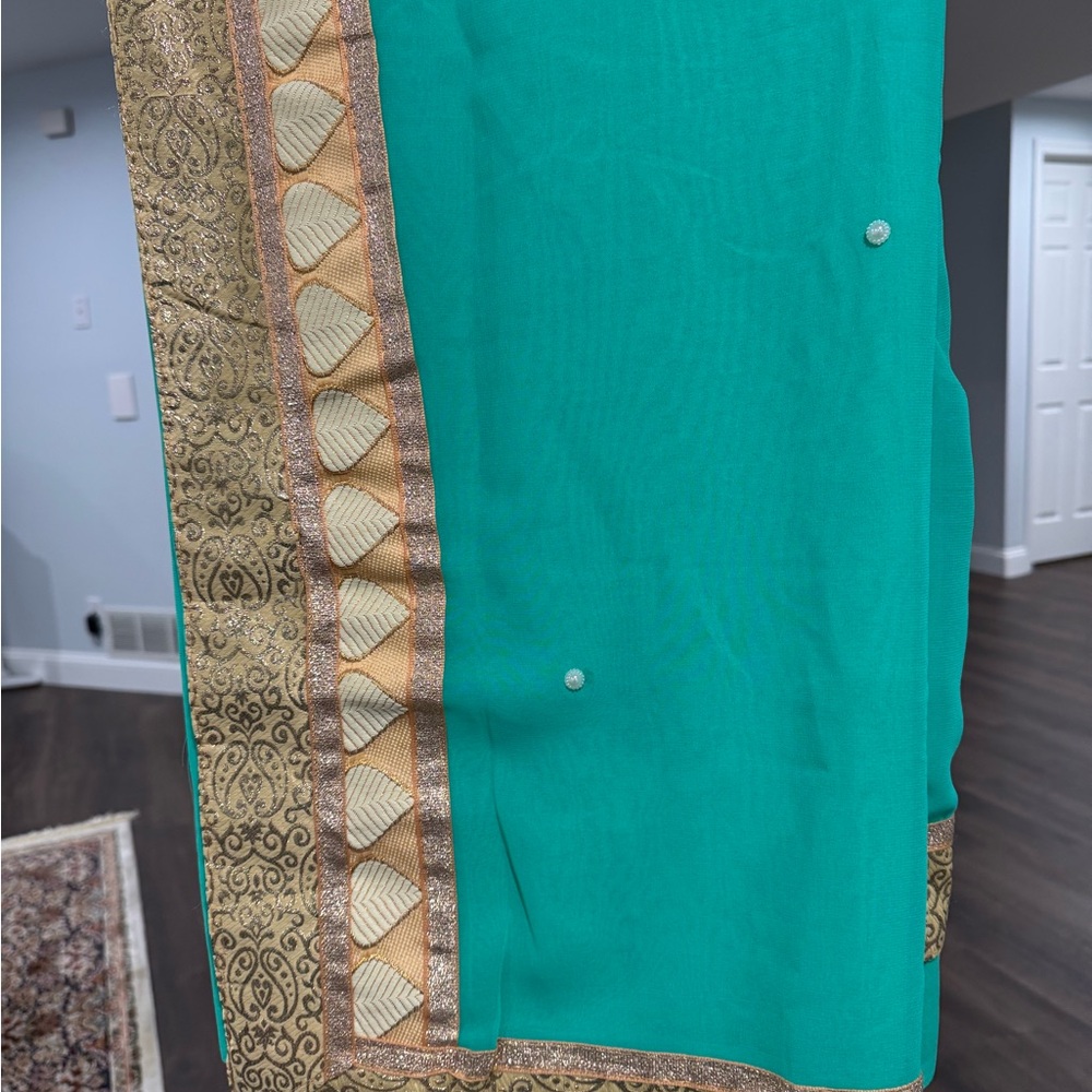 Elegant Teal Sari with Gold Border